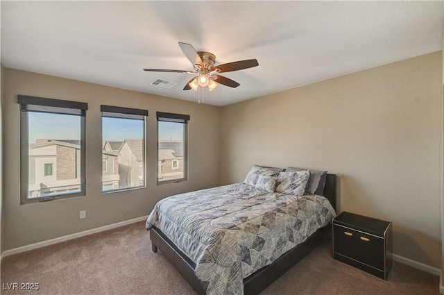 bedroom featuring visible vents, carpet flooring, baseboards, and ceiling fan