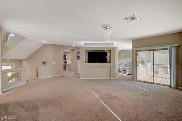 unfurnished living room featuring visible vents, baseboards, carpet flooring, and vaulted ceiling