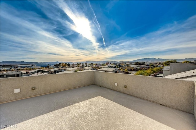 view of patio / terrace featuring a mountain view and a balcony