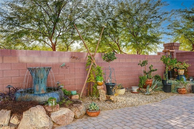 view of patio featuring fence