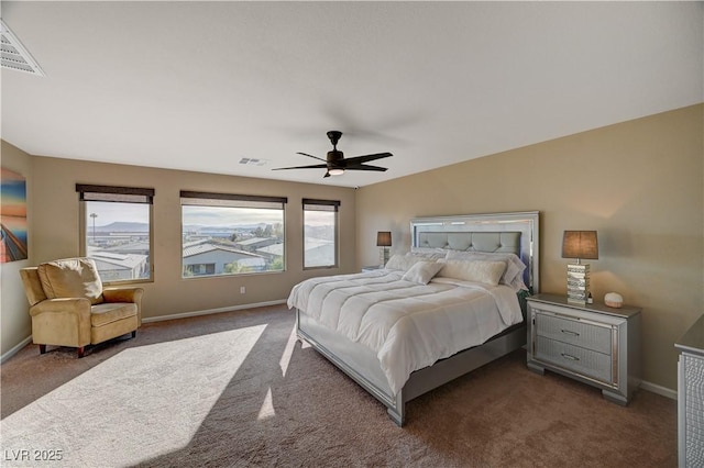 carpeted bedroom with baseboards, visible vents, and ceiling fan