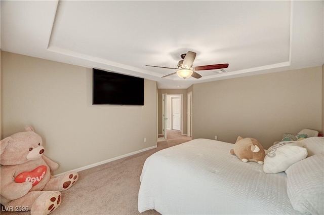 bedroom featuring visible vents, ceiling fan, baseboards, carpet flooring, and a raised ceiling