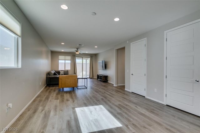 unfurnished living room featuring light wood finished floors, recessed lighting, a ceiling fan, and baseboards