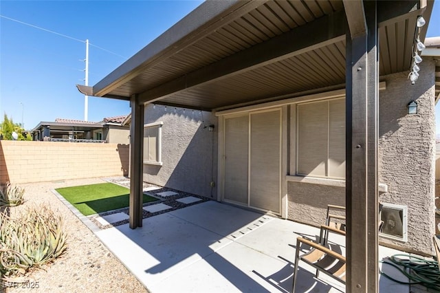 view of patio with fence