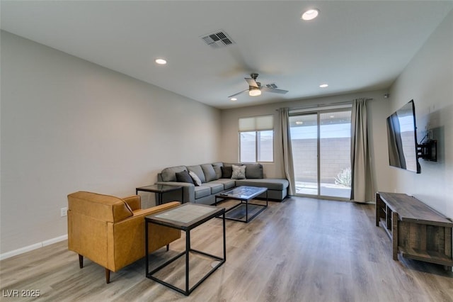 living area with visible vents, baseboards, ceiling fan, recessed lighting, and light wood-style floors