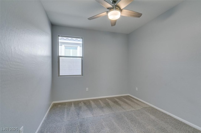 carpeted empty room with baseboards and ceiling fan