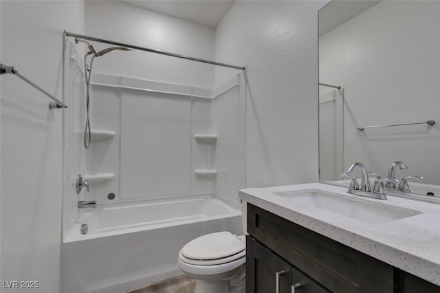 full bath featuring vanity, toilet, and washtub / shower combination