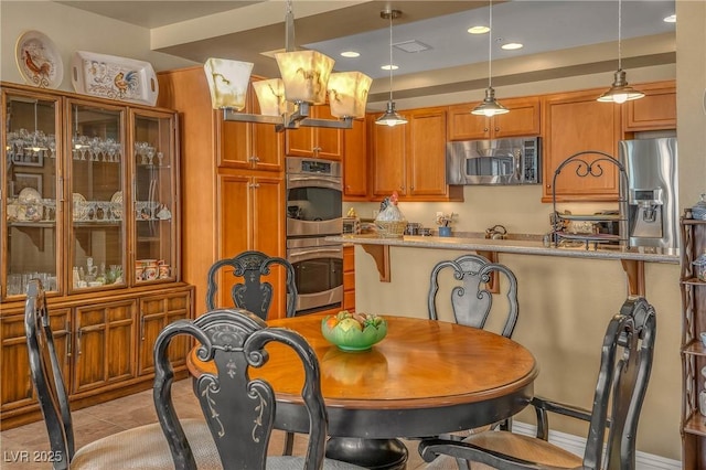 dining area featuring recessed lighting