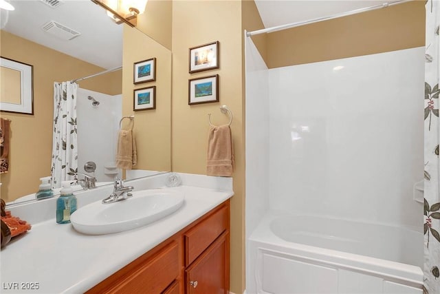 bathroom with vanity, visible vents, and shower / tub combo with curtain