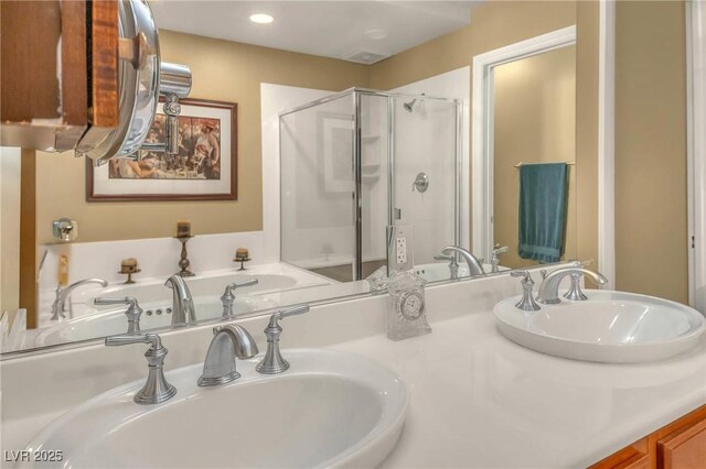 64 Strada Principale Unit 307, Henderson, NV 89011 - bathroom featuring a shower stall, double vanity, recessed lighting, and a bathtub