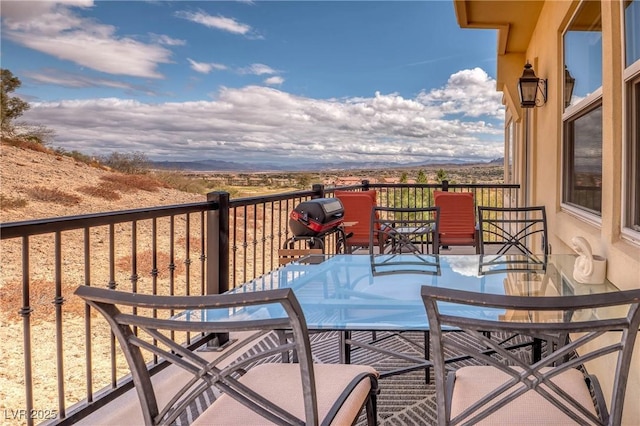 balcony featuring a grill and a mountain view