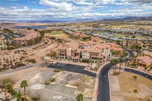 birds eye view of property featuring a residential view and a water and mountain view