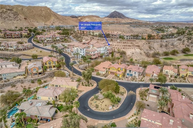 birds eye view of property featuring a mountain view and a residential view