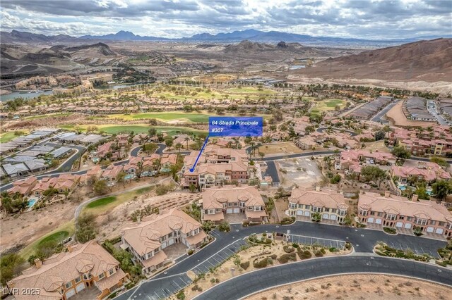 64 Strada Principale Unit 307, Henderson, NV 89011 - aerial view of property and surrounding area featuring mountains, nearby suburban area, and a golf course