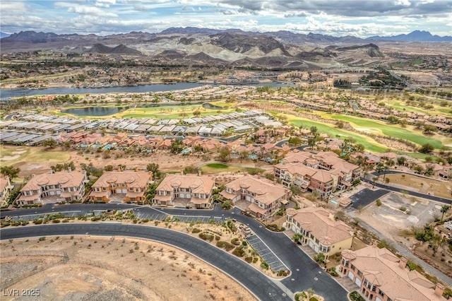 drone / aerial view featuring a residential view and a water and mountain view