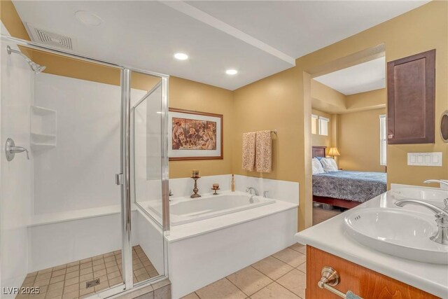 64 Strada Principale Unit 307, Henderson, NV 89011 - ensuite bathroom featuring a shower stall, a bath, tile patterned floors, double vanity, and recessed lighting
