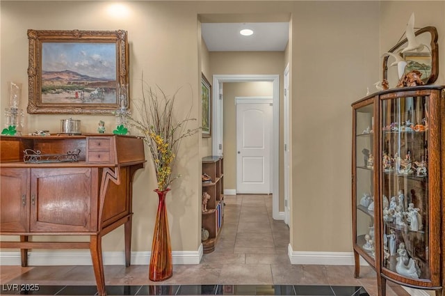 hallway featuring baseboards