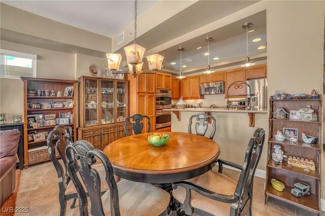 64 Strada Principale Unit 307, Henderson, NV 89011 - dining space with a chandelier, recessed lighting, and light tile patterned floors