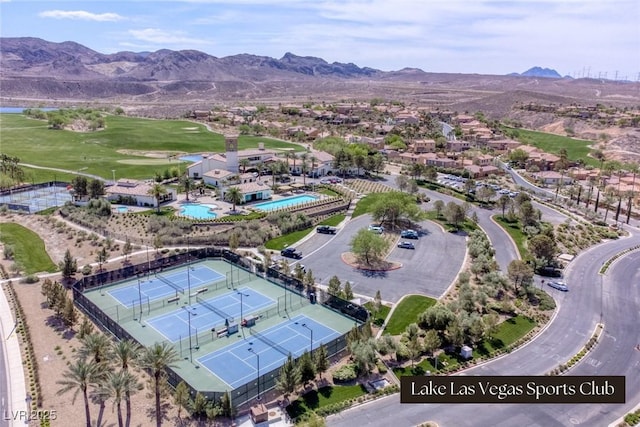 birds eye view of property with a mountain view