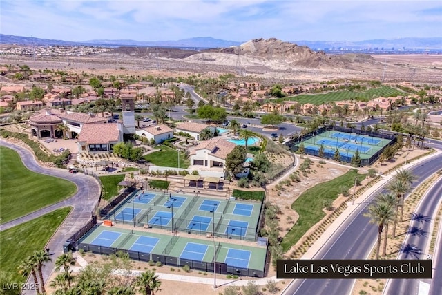 birds eye view of property with a mountain view and a residential view