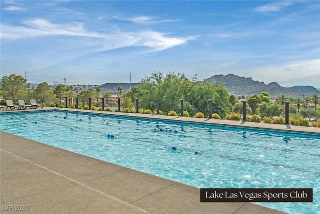 pool featuring a mountain view and a patio