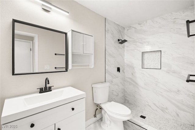 full bathroom featuring vanity, toilet, marble finish floor, and a marble finish shower