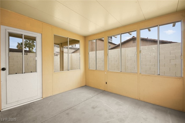 unfurnished sunroom featuring plenty of natural light