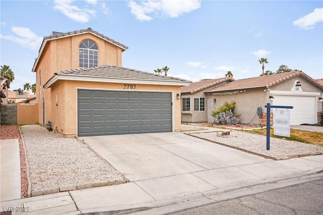 view of front facade featuring stucco siding, concrete driveway, an attached garage, and a tiled roof