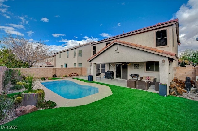 rear view of property with stucco siding, a lawn, a patio, a fenced backyard, and a fenced in pool