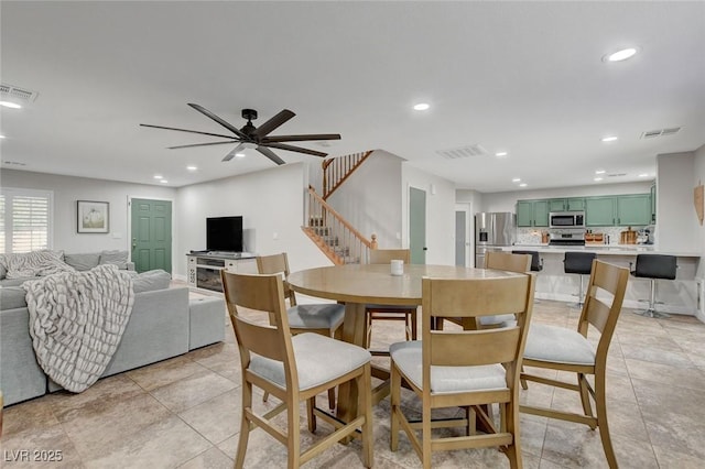 dining space with visible vents, recessed lighting, and stairway