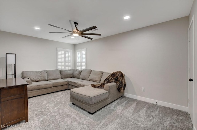 living room with recessed lighting, a ceiling fan, light colored carpet, and baseboards