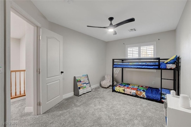 bedroom with carpet flooring, ceiling fan, baseboards, and visible vents