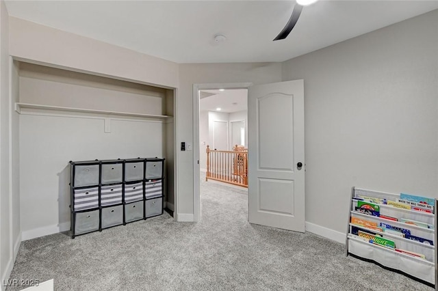 carpeted bedroom with baseboards and a ceiling fan