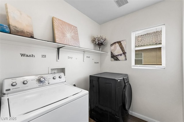 clothes washing area featuring laundry area, washing machine and dryer, baseboards, and visible vents