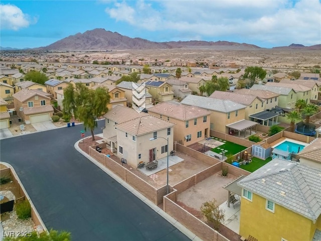 drone / aerial view featuring a mountain view and a residential view