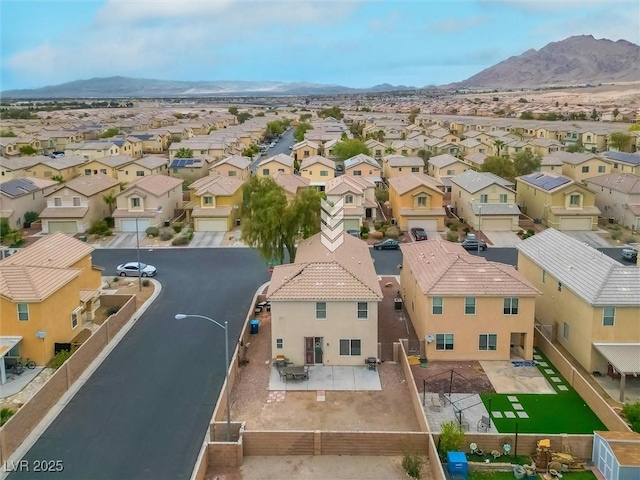 aerial view featuring a mountain view and a residential view