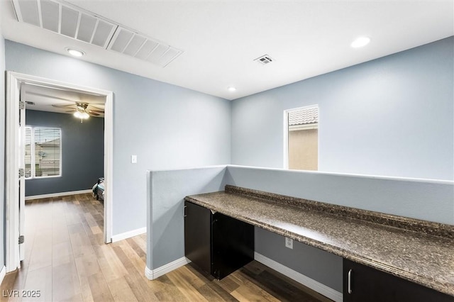 unfurnished office featuring visible vents, ceiling fan, baseboards, light wood-type flooring, and recessed lighting