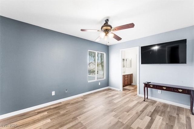 6429 Pronghorn Ridge Ave, Las Vegas, NV 89122 - unfurnished bedroom featuring light wood-type flooring, baseboards, ensuite bathroom, and ceiling fan