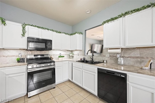 6429 Pronghorn Ridge Ave, Las Vegas, NV 89122 - kitchen with black appliances, a sink, light countertops, white cabinetry, and decorative backsplash