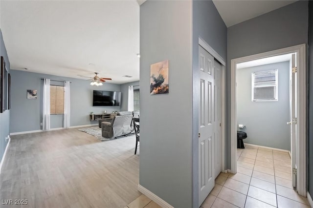 6429 Pronghorn Ridge Ave, Las Vegas, NV 89122 - corridor featuring healthy amount of natural light, baseboards, and light tile patterned floors