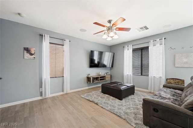 6429 Pronghorn Ridge Ave, Las Vegas, NV 89122 - living area with wood finished floors, a ceiling fan, and baseboards