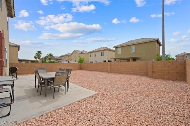 6429 Pronghorn Ridge Ave, Las Vegas, NV 89122 - fenced backyard featuring a residential view and a patio