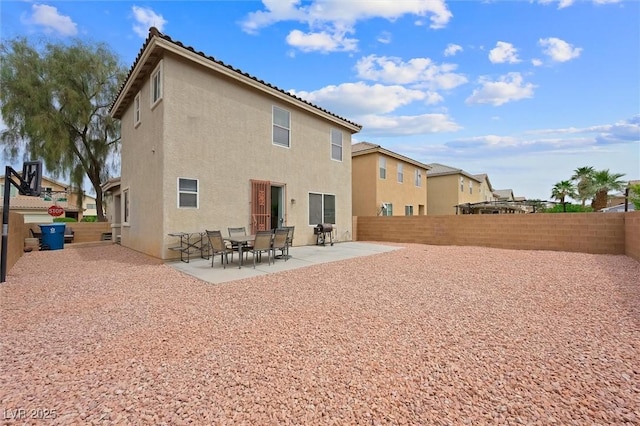 6429 Pronghorn Ridge Ave, Las Vegas, NV 89122 - rear view of house with stucco siding, a patio, and a fenced backyard