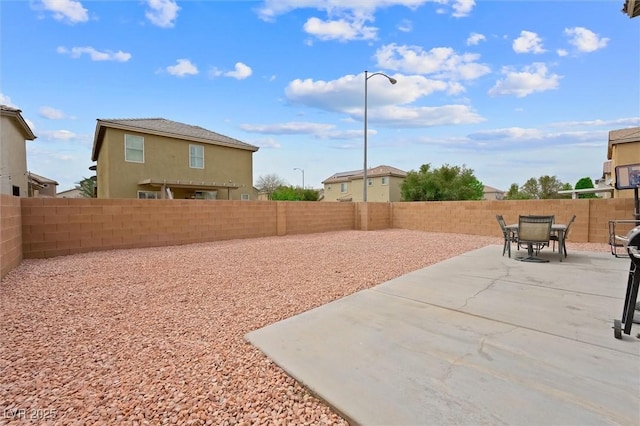 6429 Pronghorn Ridge Ave, Las Vegas, NV 89122 - fenced backyard with a patio area and outdoor dining space