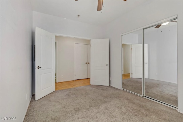 unfurnished bedroom featuring a closet, carpet, and ceiling fan