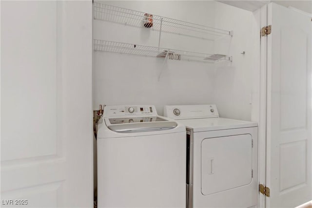 laundry area with independent washer and dryer and laundry area