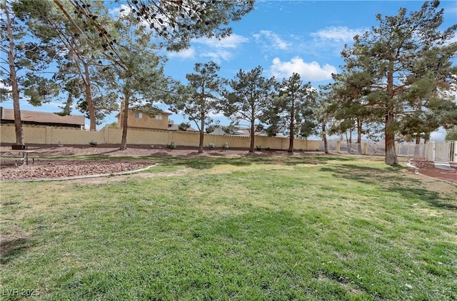 view of yard with a fenced backyard