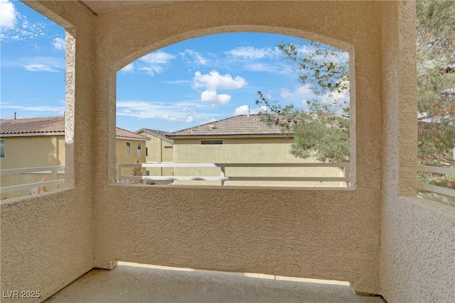 view of patio featuring a balcony