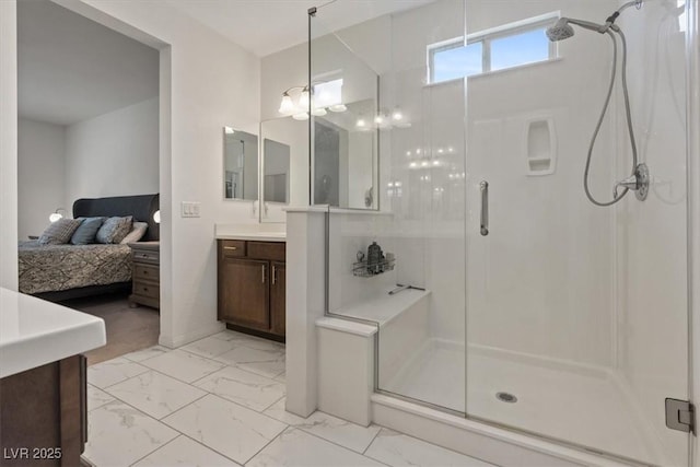 full bathroom with marble finish floor, a stall shower, ensuite bath, and vanity