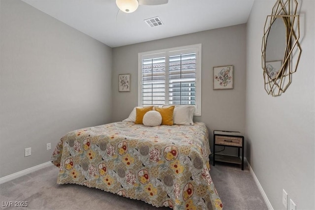 bedroom with visible vents, carpet floors, baseboards, and ceiling fan